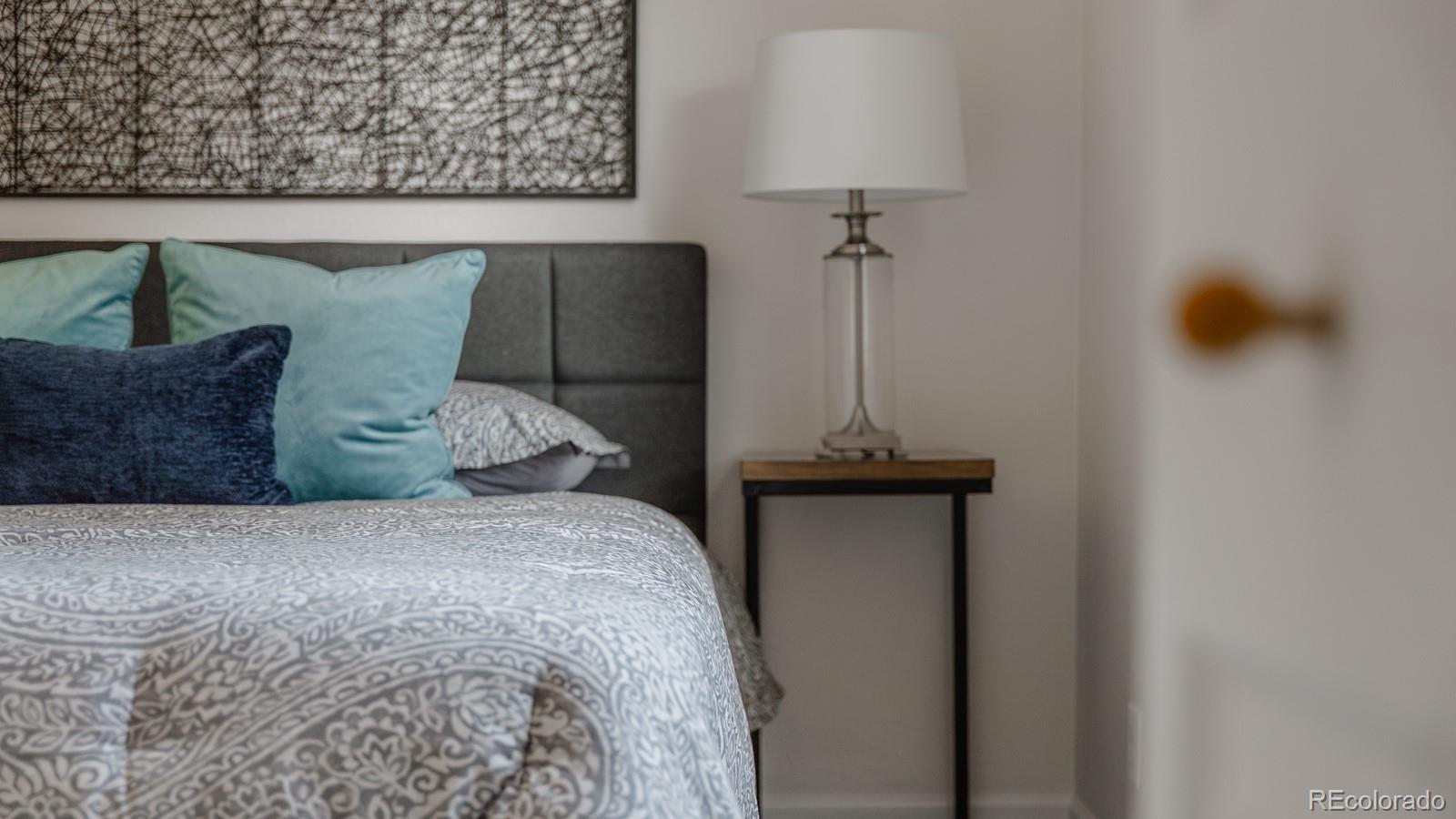 2260 Lilly Drive Thornton, CO 80229 - Photo 18 of 33 a bed room with a bed