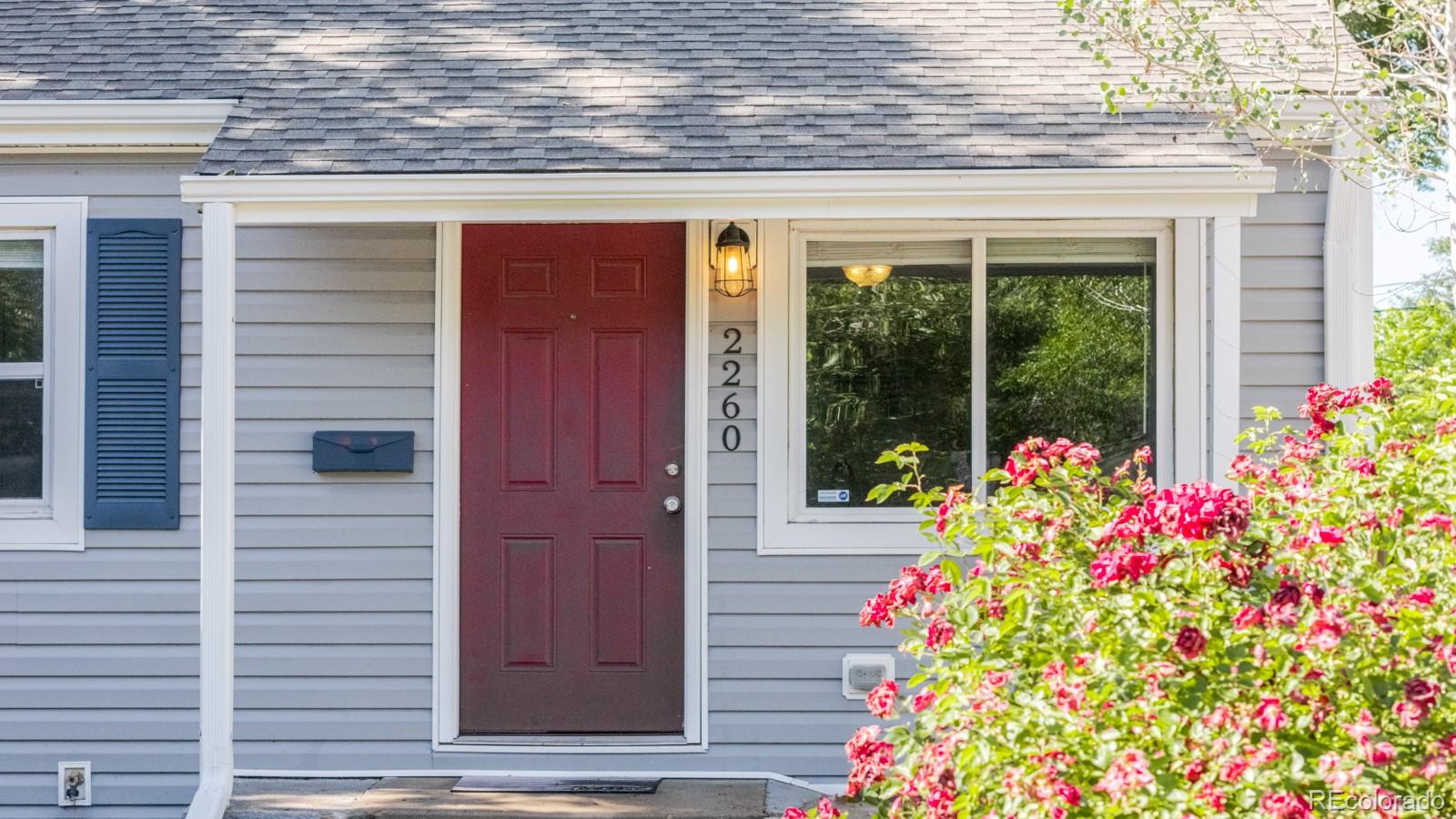 2260 Lilly Drive Thornton, CO 80229 - Photo 2 of 33 a front view of a house with a porch