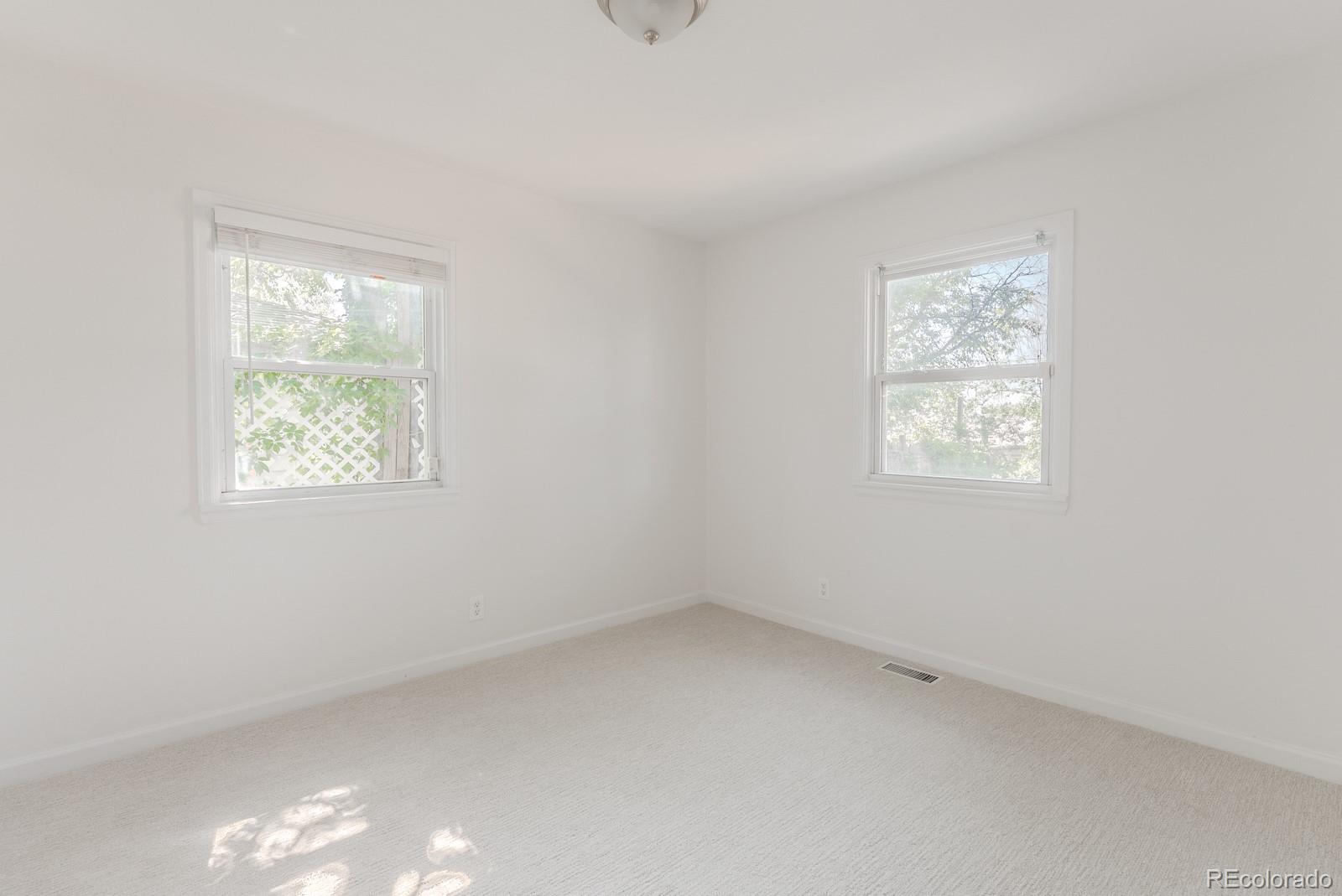 2260 Lilly Drive Thornton, CO 80229 - Photo 23 of 33 an empty room with windows