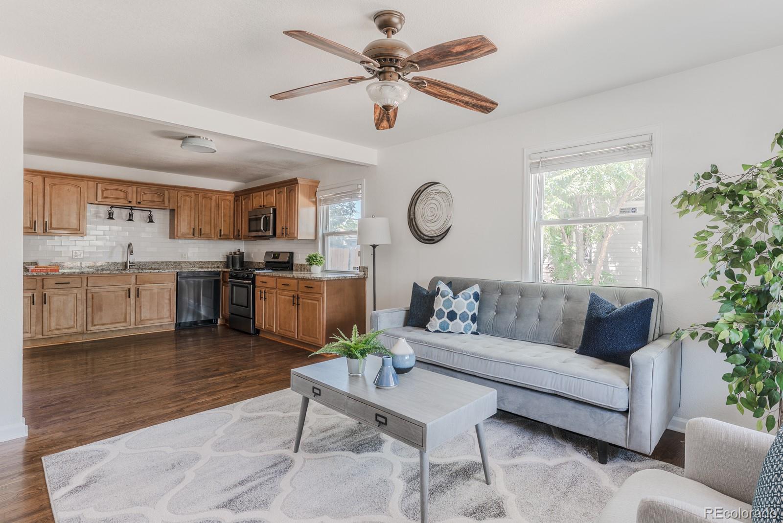 2260 Lilly Drive Thornton, CO 80229 - Photo 3 of 33 a living room with furniture and kitchen view
