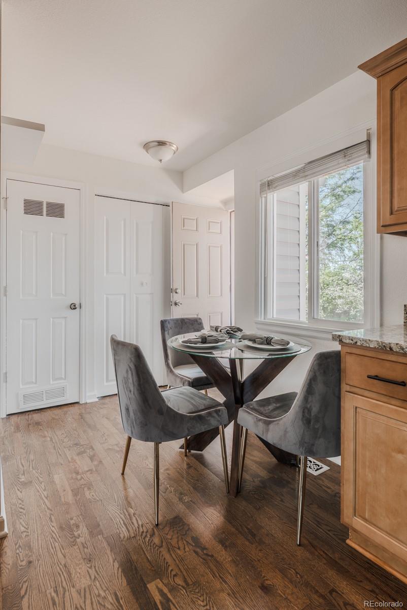 2260 Lilly Drive Thornton, CO 80229 - Photo 8 of 33 a view of a dining room with furniture and wooden floor