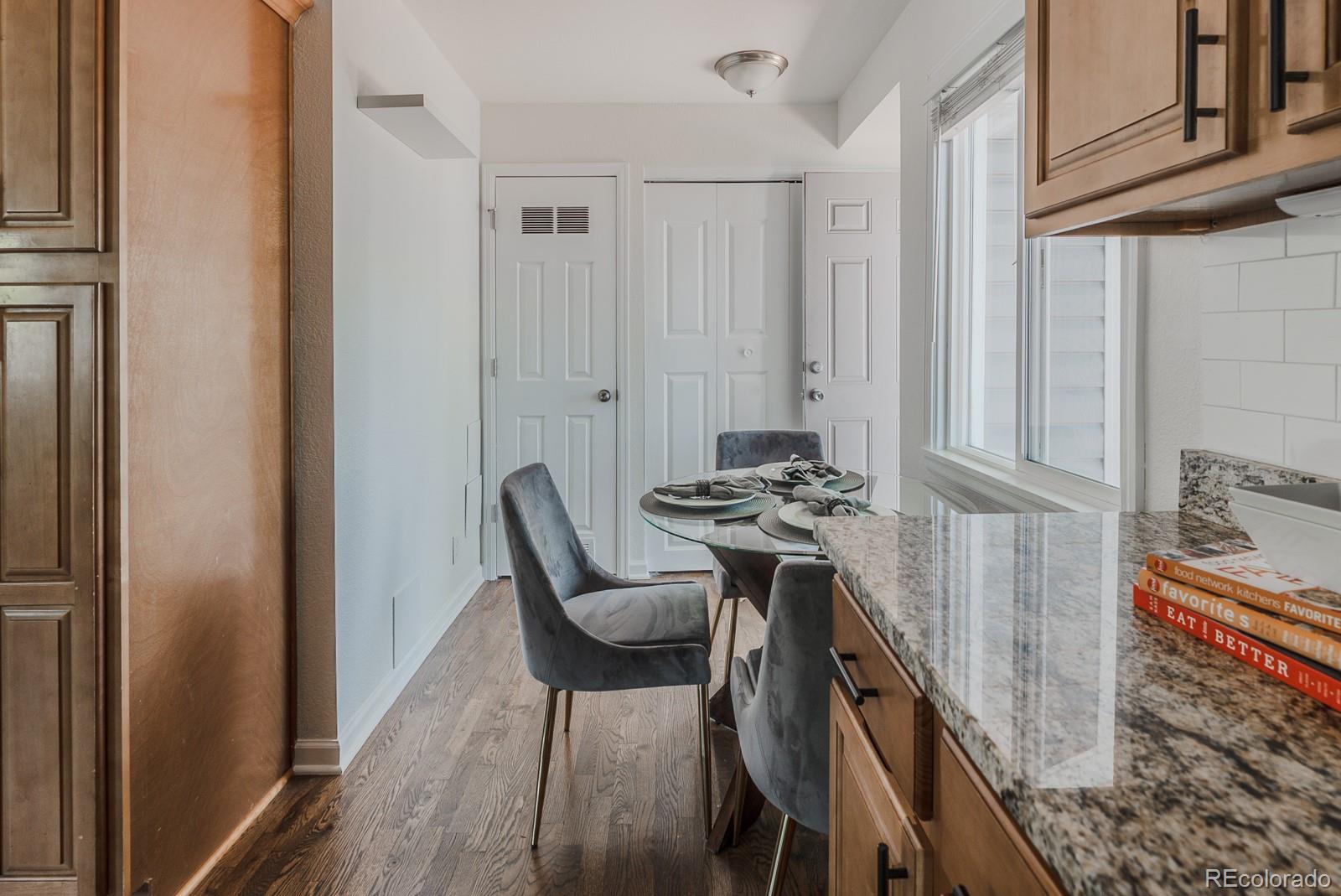 2260 Lilly Drive Thornton, CO 80229 - Photo 9 of 33 a view of a dining room with furniture and wooden floor