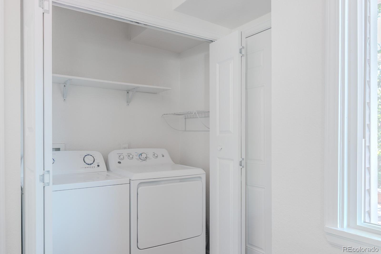 2260 Lilly Drive Thornton, CO 80229 - Photo 10 of 33 a utility room with dryer and washer
