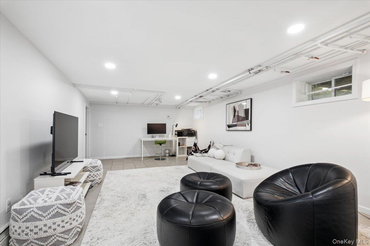 337 Heathcote Road Scarsdale, NY 10583 - Photo 24 of 33 Basement playroom, 1/2 bath and gym