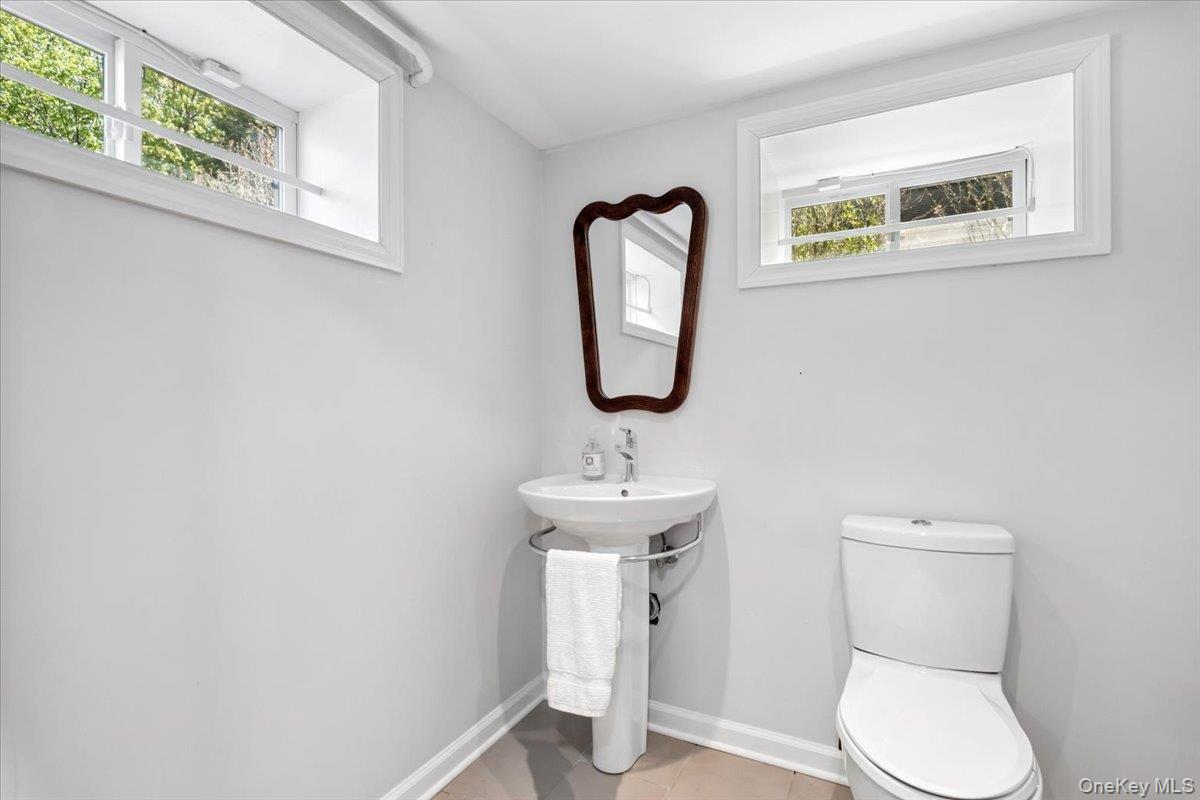 337 Heathcote Road Scarsdale, NY 10583 - Photo 25 of 33 Basement playroom, 1/2 bath and gym