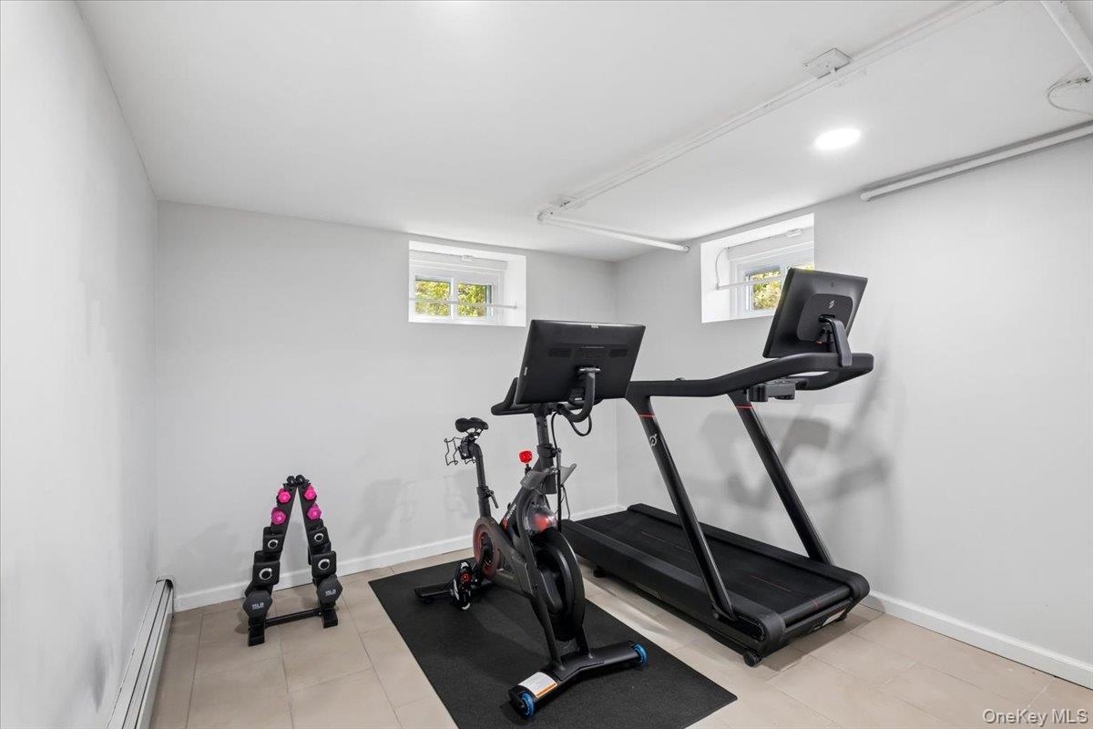 337 Heathcote Road Scarsdale, NY 10583 - Photo 26 of 33 Basement playroom, 1/2 bath and gym