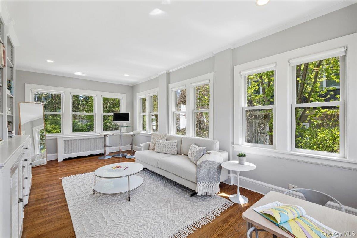 337 Heathcote Road Scarsdale, NY 10583 - Photo 6 of 33 Sun room with walls of windows