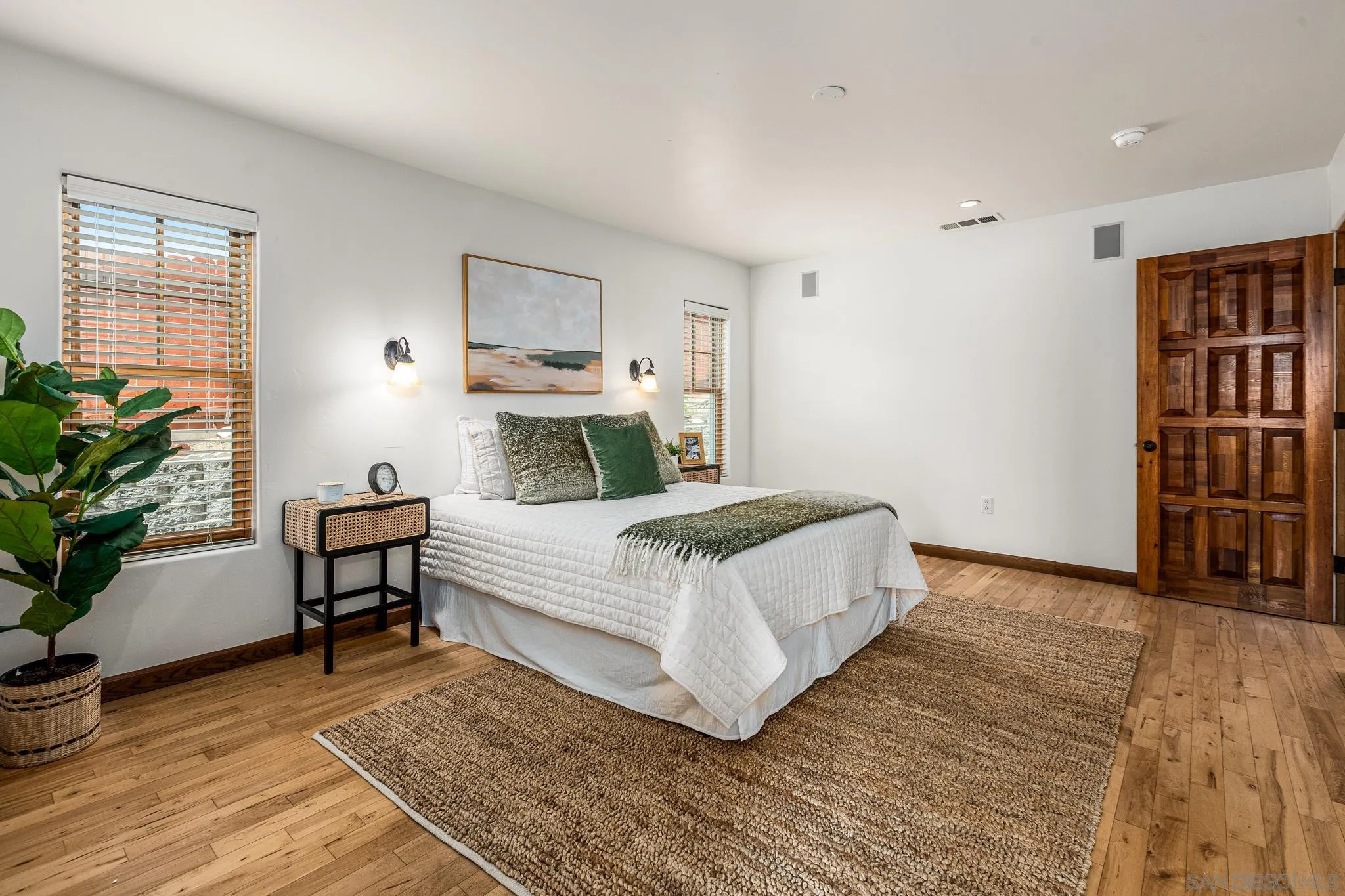 15315 Jenell Street Poway, CA 92064 - Photo 13 of 24 a bedroom with a bed and a potted plant