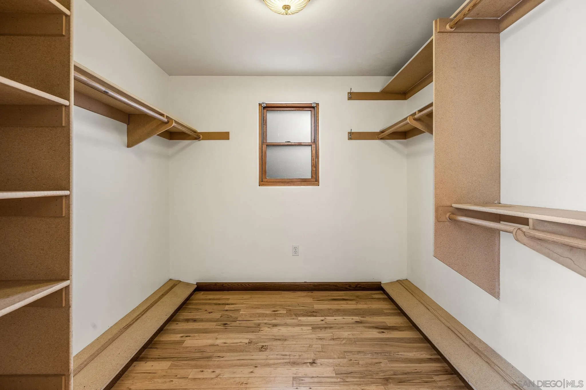 15315 Jenell Street Poway, CA 92064 - Photo 14 of 24 a view of a room with wooden floor and a window