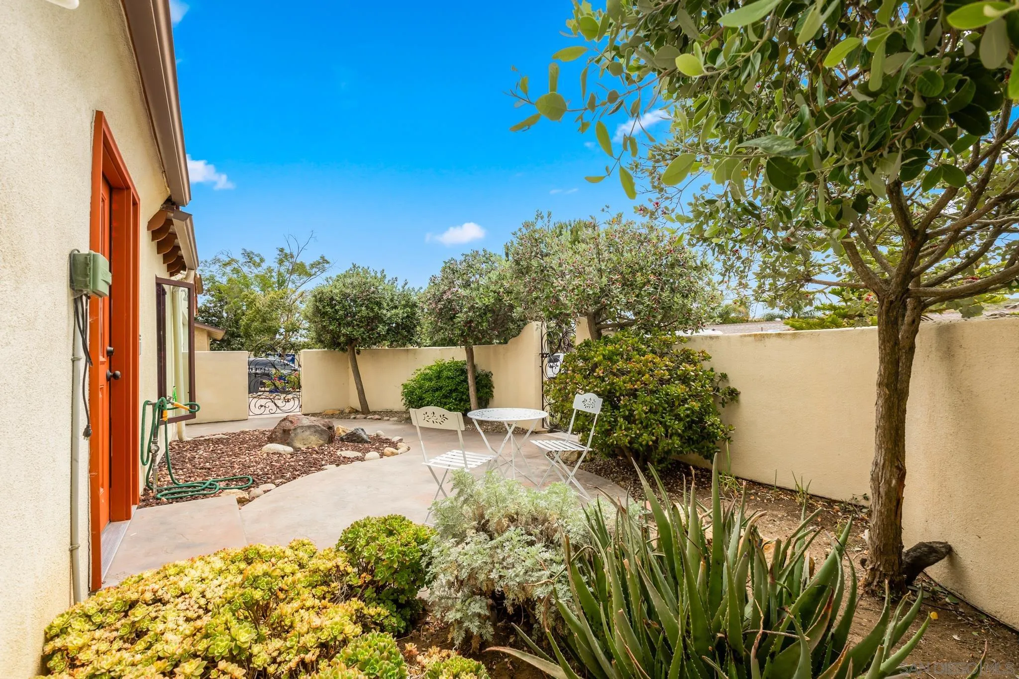 15315 Jenell Street Poway, CA 92064 - Photo 2 of 24 a backyard of a house with table and chairs