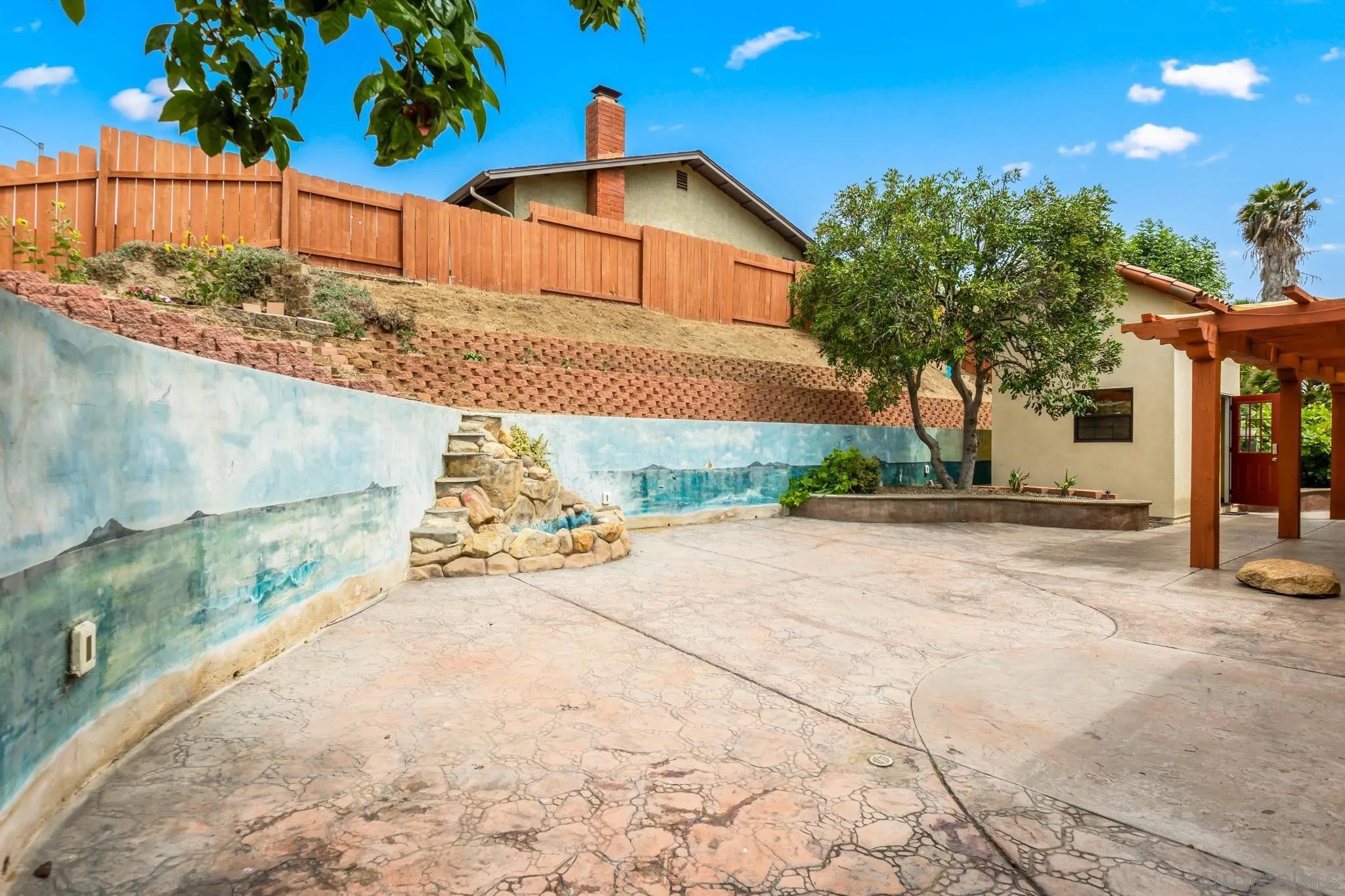 15315 Jenell Street Poway, CA 92064 - Photo 24 of 24 a view of a house with a yard and potted plants