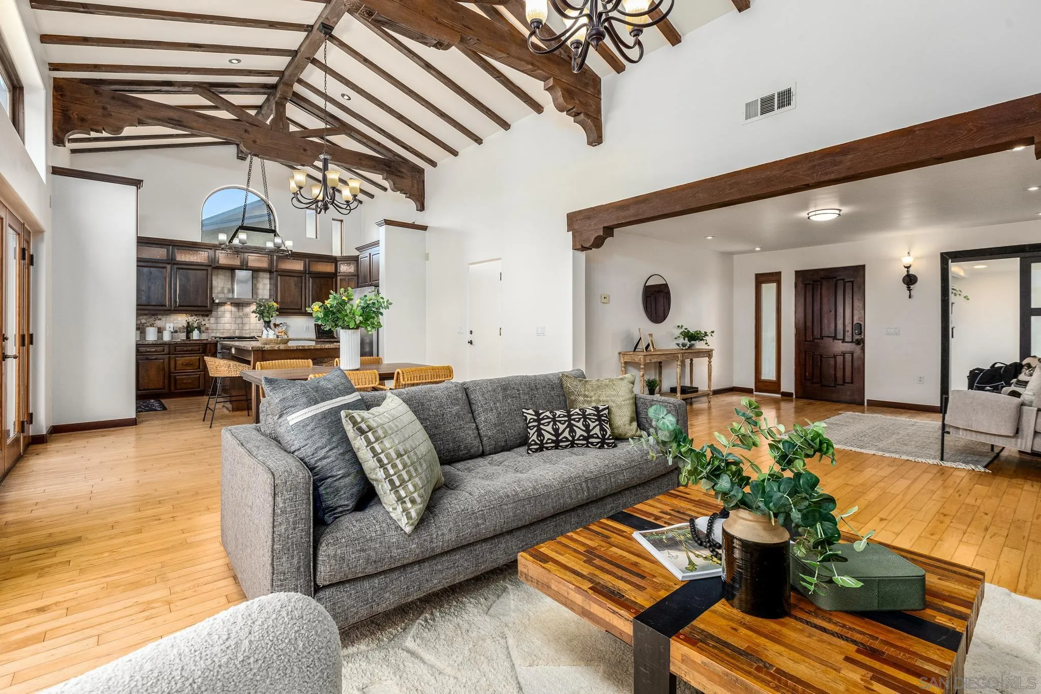15315 Jenell Street Poway, CA 92064 - Photo 3 of 24 a living room with furniture and a chandelier