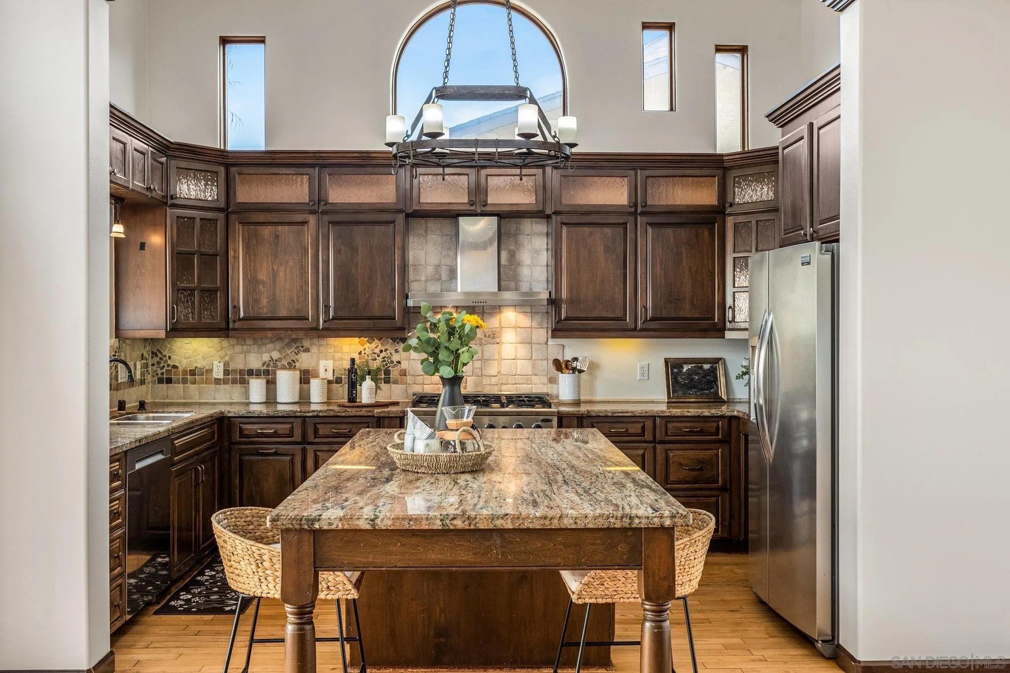 15315 Jenell Street Poway, CA 92064 - Photo 9 of 24 a kitchen with a table and chairs in it