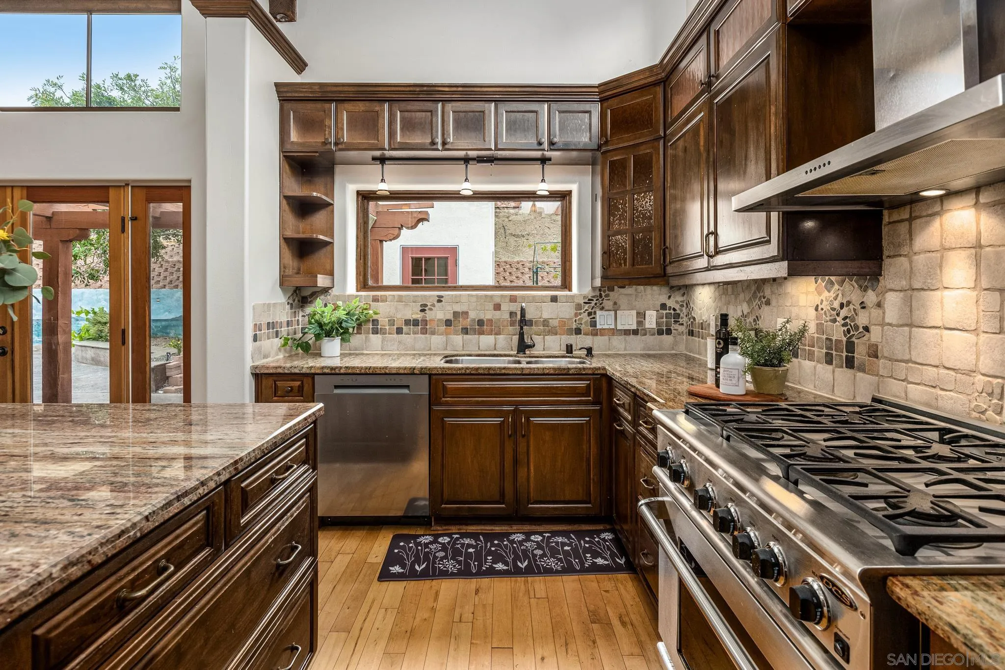 15315 Jenell Street Poway, CA 92064 - Photo 10 of 24 a kitchen with a stove and a sink
