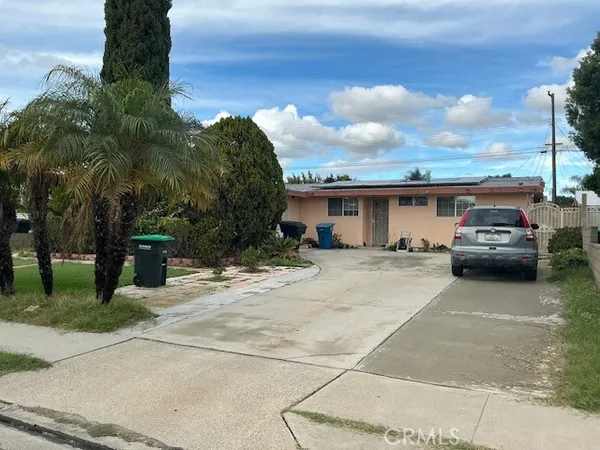a view of a car parked in front of a house