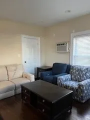 a living room with furniture and a couch