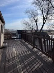 a view of terrace with wooden floor and fence