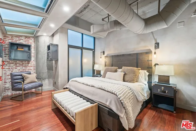 a bed room with a bed and a couch