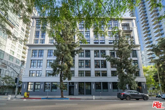 a front view of a building with lot of windows