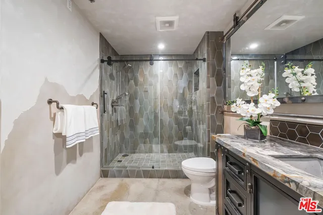 a room with lots of wooden furniture and windows