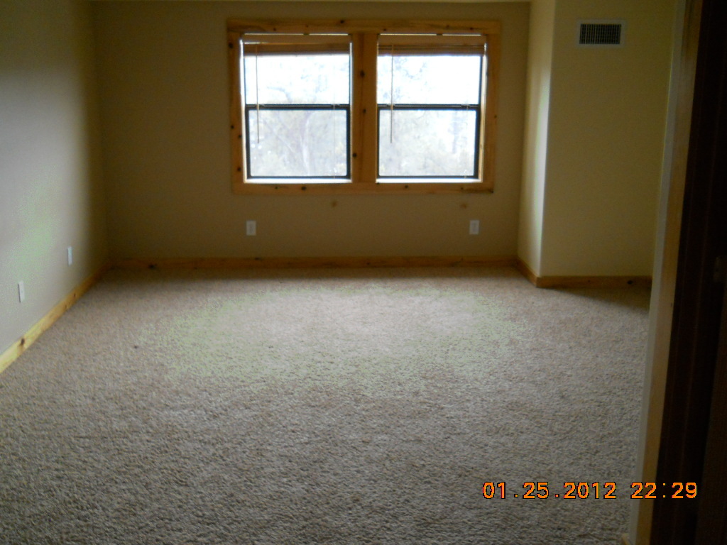 2923 Elk Trail Road Heber, AZ 85928 - Photo 5 of 12 an empty room with a window