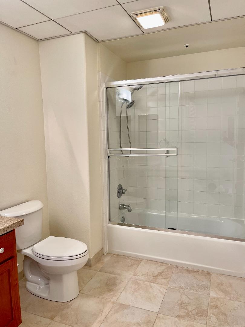 423 7th Street, Unit 516 Oakland, CA 94607 - Photo 16 of 21 a bathroom with a toilet and a shower