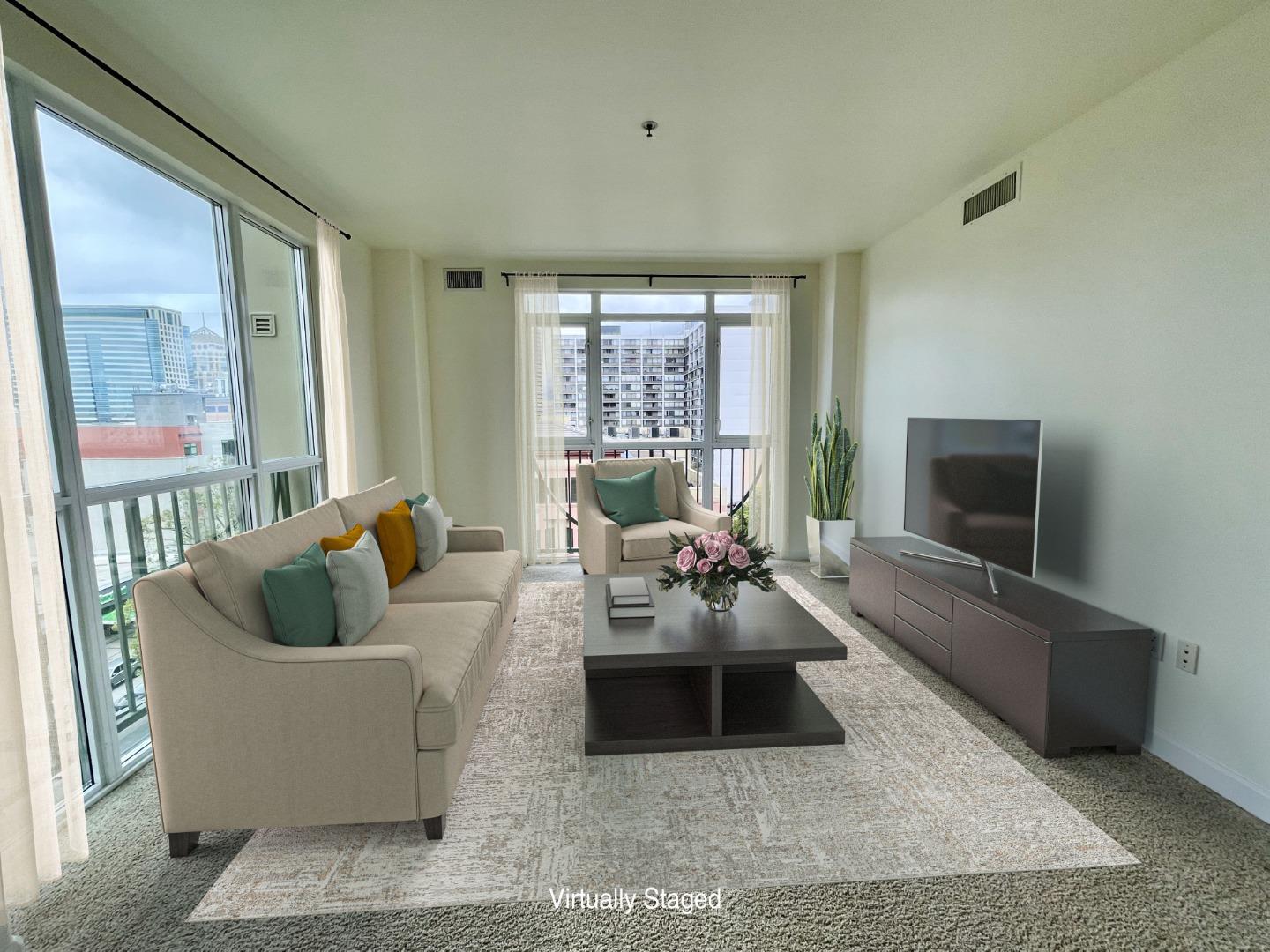 423 7th Street, Unit 516 Oakland, CA 94607 - Photo 3 of 21 a living room with furniture and a couch