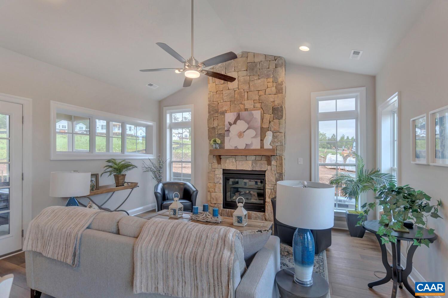1259 Farrow Drive Charlottesville, VA 22901 - Photo 22 of 48 a living room with furniture a fireplace and a potted plant