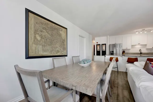 a view of a dining room with furniture and wooden floor