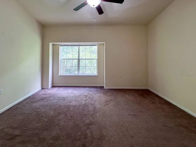 an empty room with a empty space and a window
