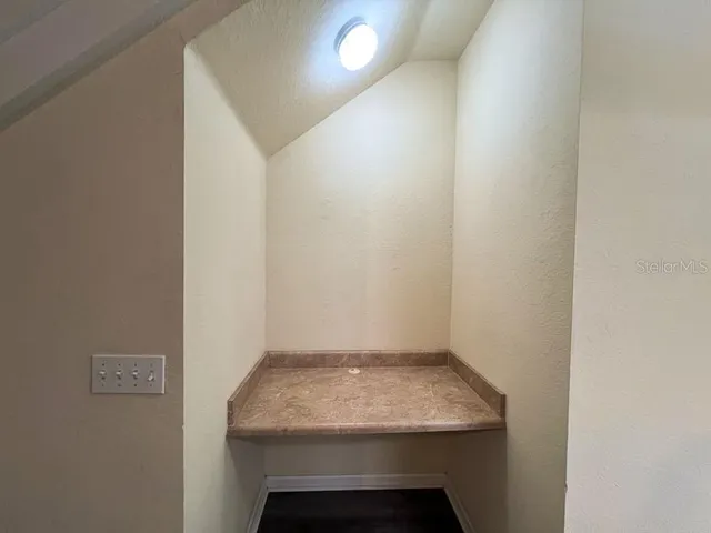 a bathroom with a sink and vanity