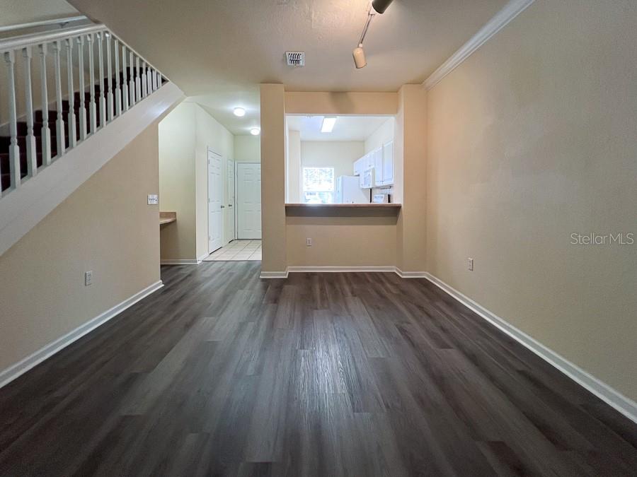 4886 Northwest 46th Place, Unit 106 Gainesville, FL 32606 - Photo 26 of 29 wooden floor in an empty room with a window