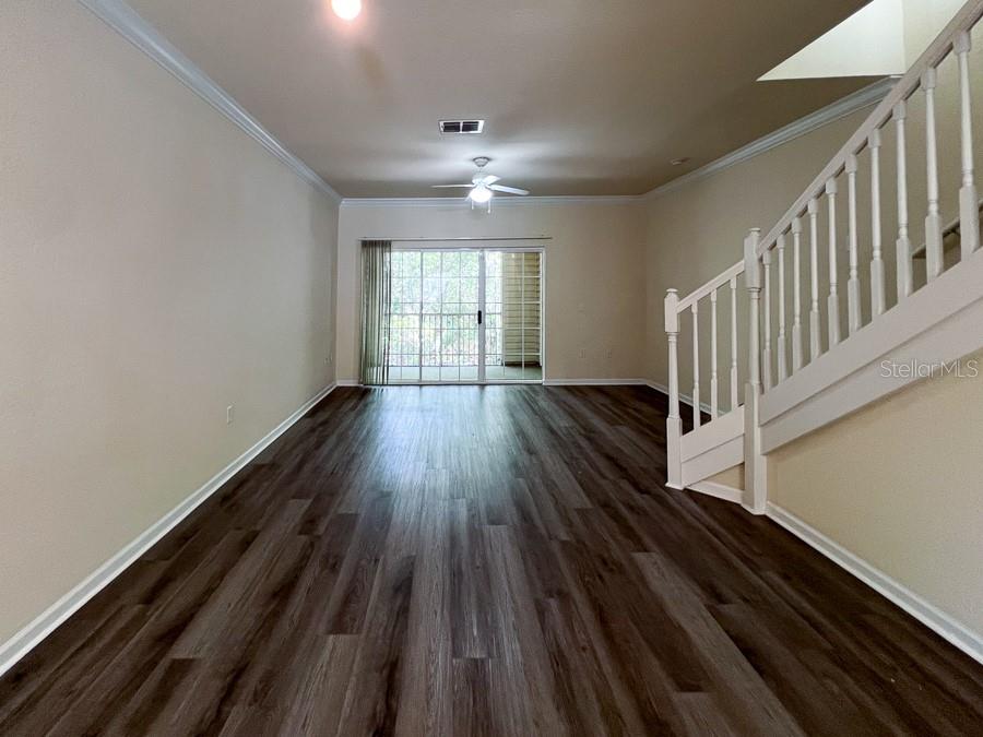 4886 Northwest 46th Place, Unit 106 Gainesville, FL 32606 - Photo 7 of 29 a view of entryway with wooden floor