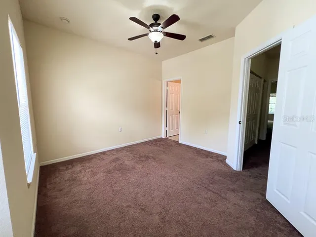 a view of a ceiling fan in a room