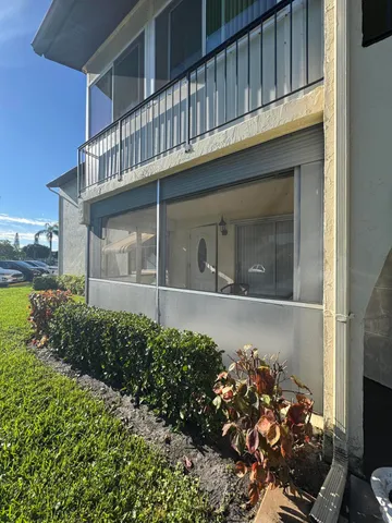 a view of a house with a flower garden