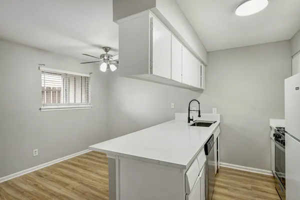 a kitchen that has a sink and a stove
