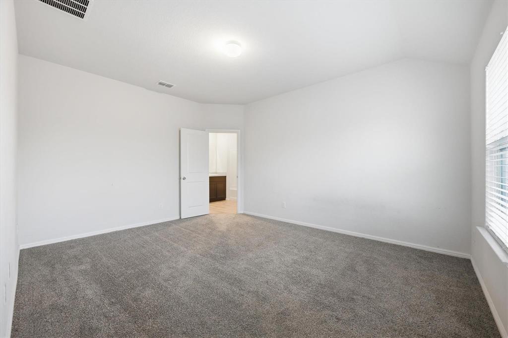 9308 Desertrock Road Fort Worth, TX 76131 - Photo 13 of 29 an empty room with an entryway