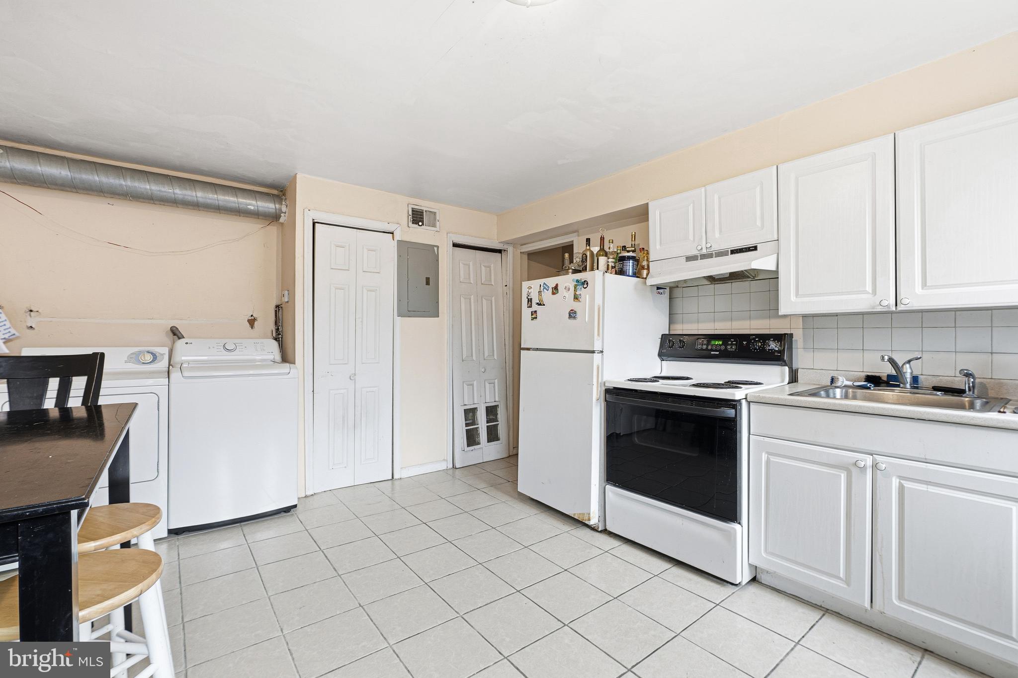 252-254 South Street, Unit 3 Philadelphia, PA 19147 - Photo 4 of 13 a kitchen with stainless steel appliances a stove a refrigerator and cabinets
