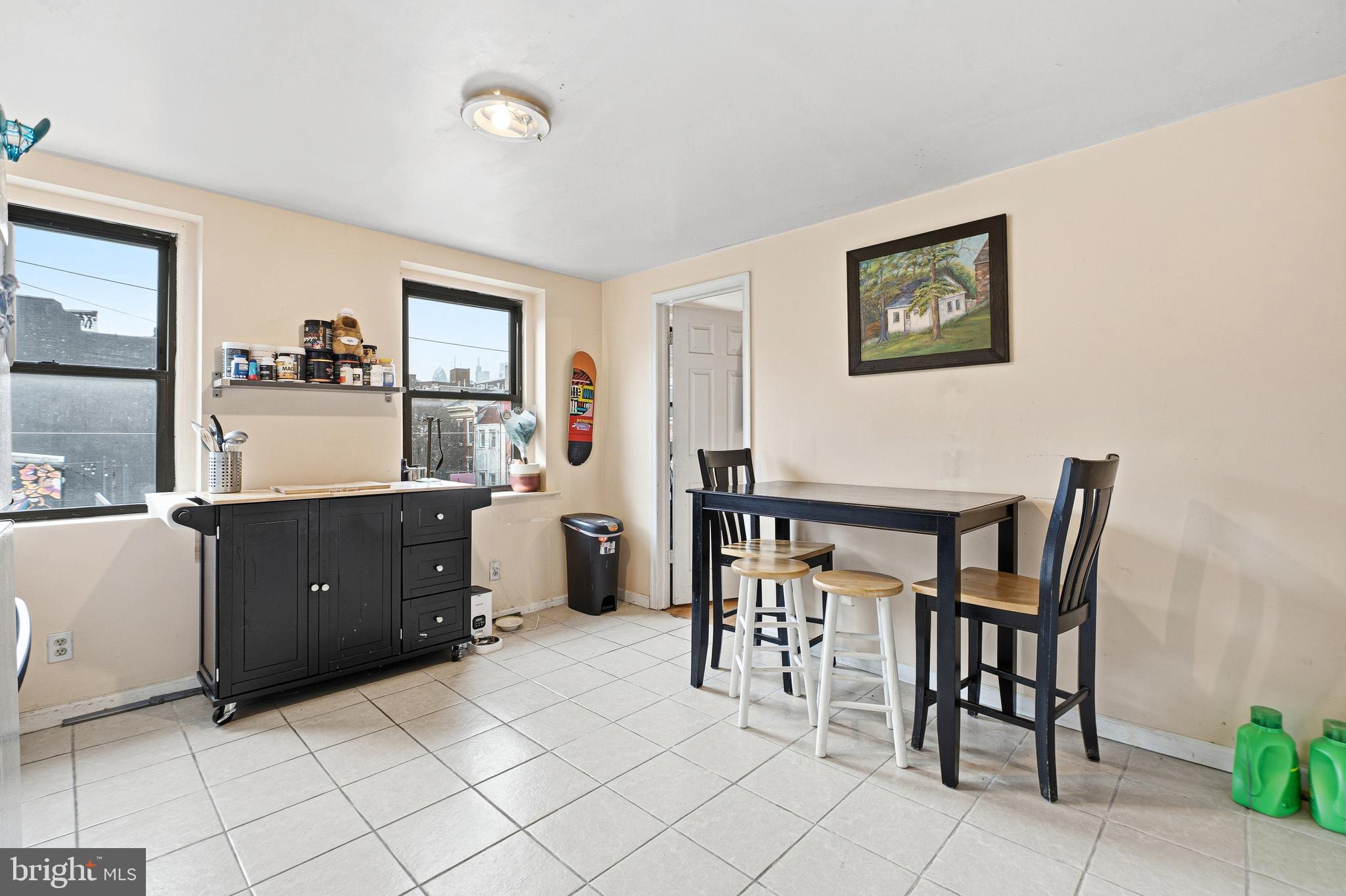 252-254 South Street, Unit 3 Philadelphia, PA 19147 - Photo 5 of 13 a living room with a wooden table and chairs