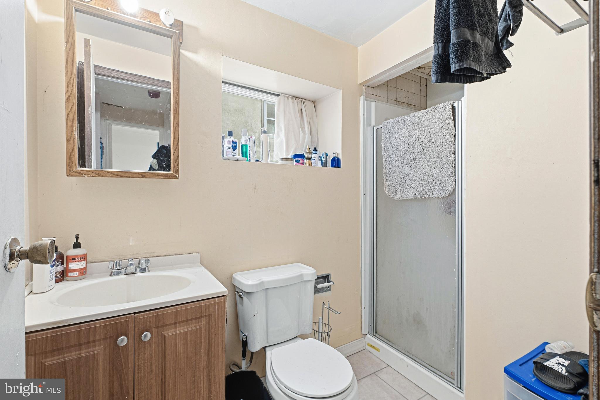 252-254 South Street, Unit 3 Philadelphia, PA 19147 - Photo 7 of 13 a bathroom with a sink vanity mirror and toilet