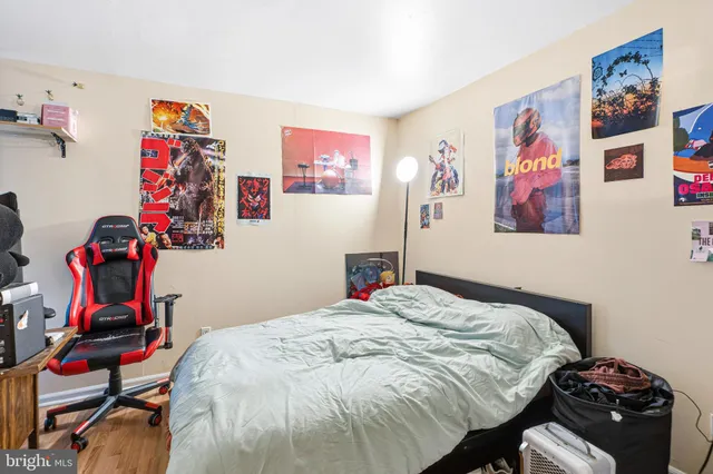 a bedroom with a bed and cabinets