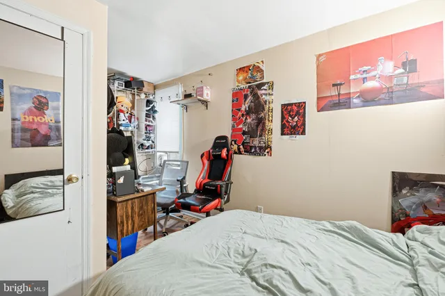 a bed room with a bed and a view of a bedroom