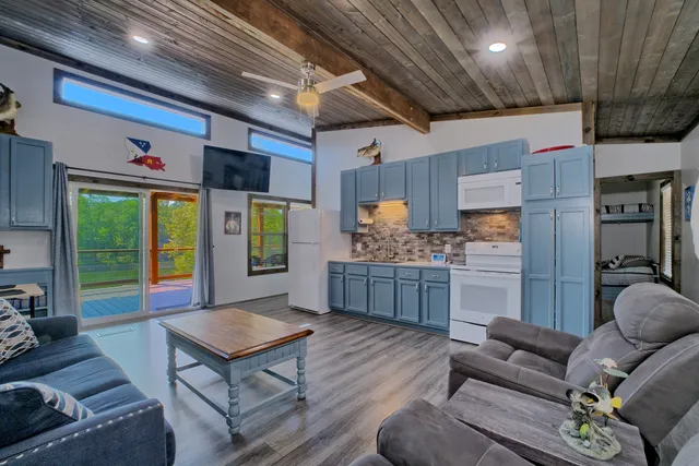 a kitchen with sink cabinets and wooden floor