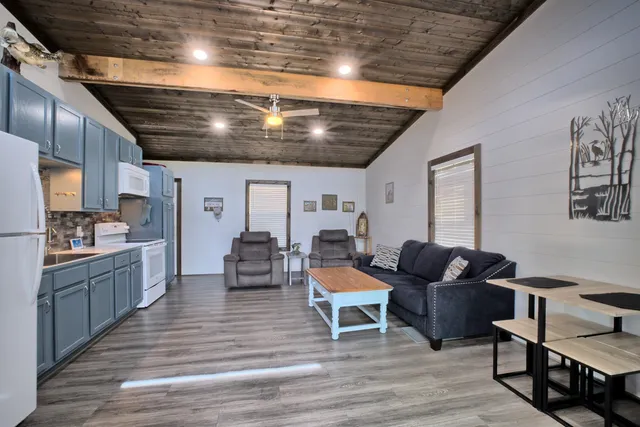 a bedroom with bed and wooden floor