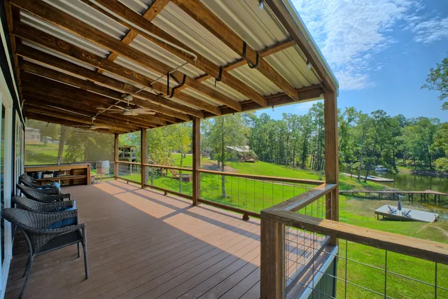 a wooden bench sitting in front of a house