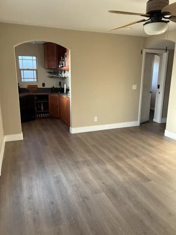 a view of a kitchen with a sink cabinets and a wooden floor