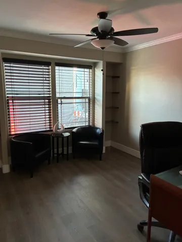 a living room with furniture and a window