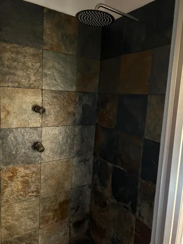 a close view of a bathroom shower