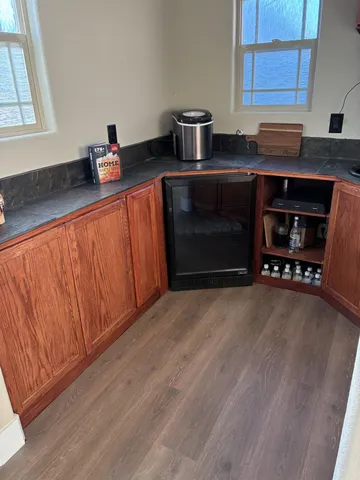 a kitchen with stainless steel appliances a stove a sink and a microwave