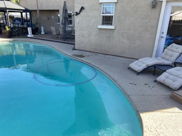 a view of swimming pool from a balcony